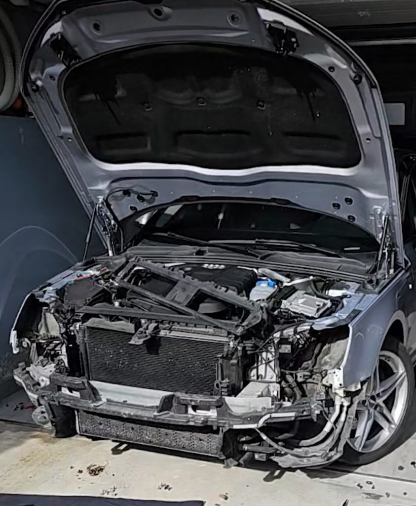 Audi A4 B9 with the front bumper removed and the bonnet open